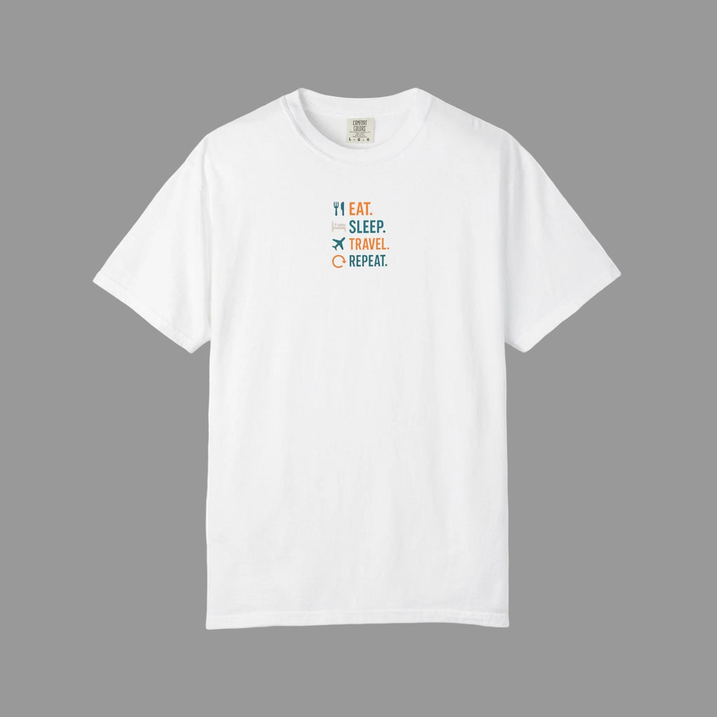 White t-shirt with text "Eat. Sleep. Travel. Repeat." with grey  background