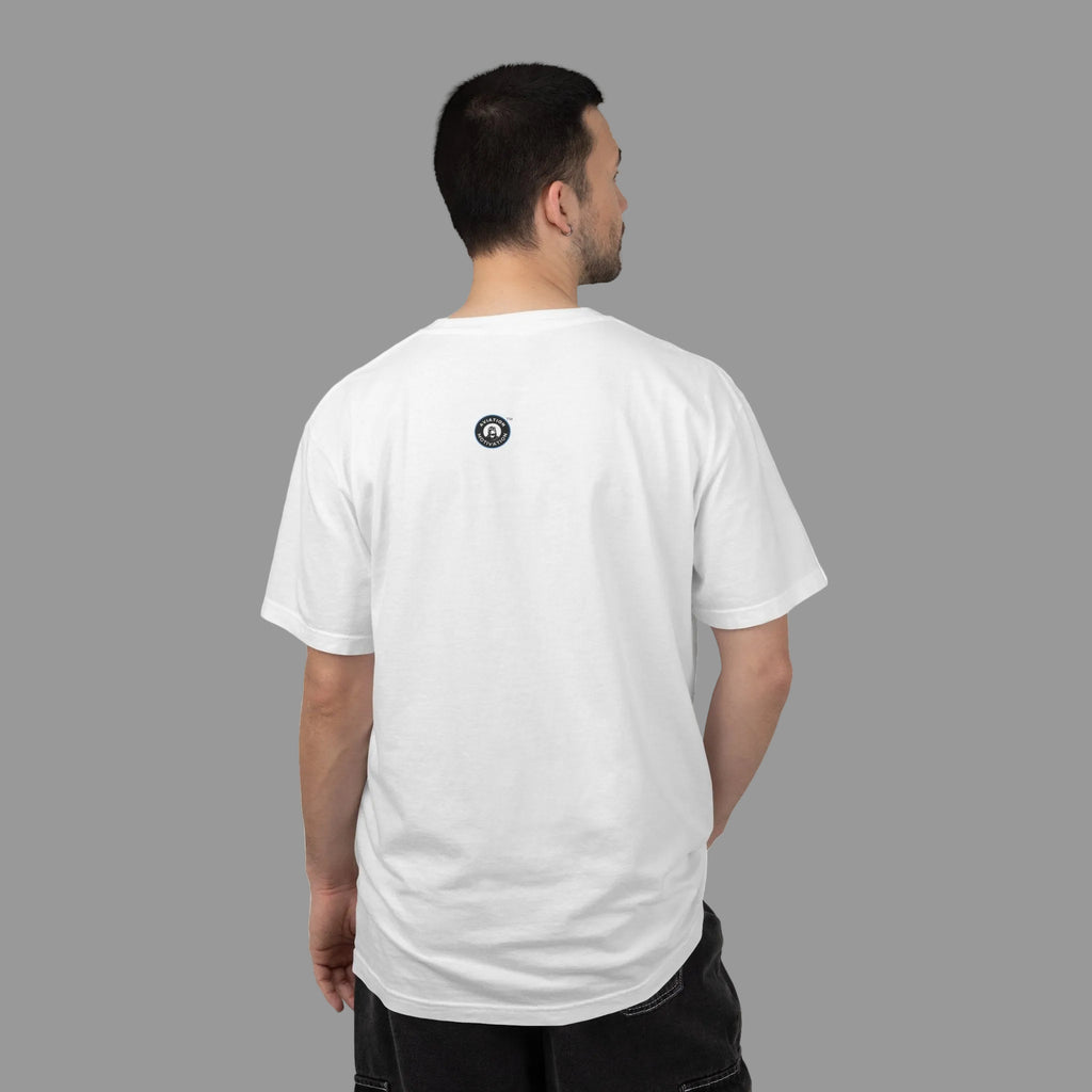 Person wearing a white t-shirt with a black and white logo on the back, standing against a shady background