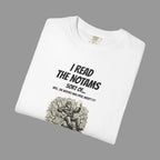 White t-shirt with black text and papers graphic on a grey background