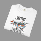 White t-shirt with airplane graphic and text on a shaded background