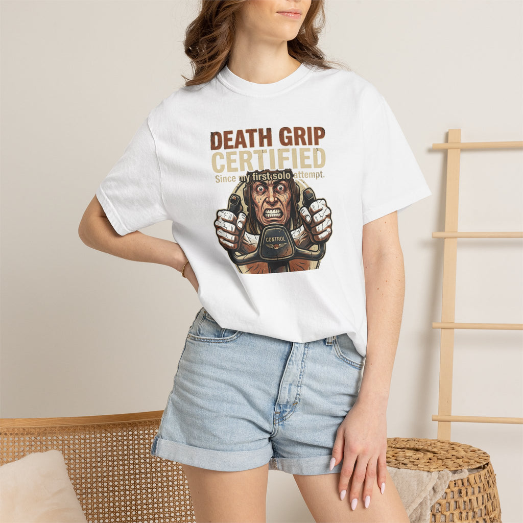 attractive woman wearing a white t-shirt with a graphic design and text, standing against a neutral home background.