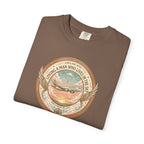 Folded brown t-shirt with airplane graphic and text on a white background